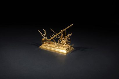 null Quatre modèles miniatures représentant des instruments aratoires.
XIXe siècle
H....