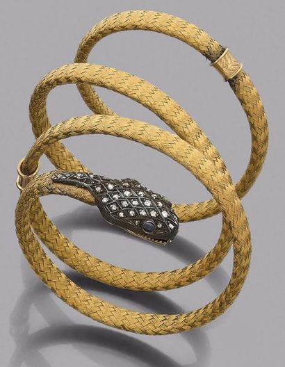 null Bracelet armille en or 18K (750‰) tressé formant un serpent, la tête en argent...