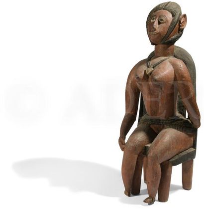 null Un lot de deux statues féminines polychromes de style baga dont une assise sur...