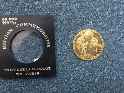 null 1 pièce en or commémorative "1er pas sur la lune". Monnaie de Paris. Poids :...