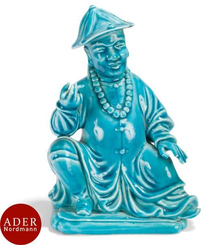 null CHINE - XIXe siècle
Statuette d’homme assis en porcelaine émaillée en bleu turquoise...