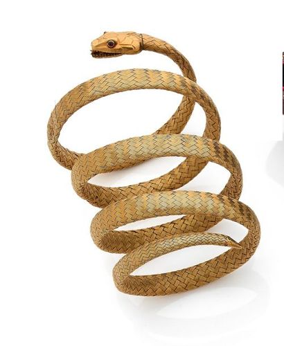 null Bracelet armille en or 18K (750) tressé représentant un serpent, les yeux piqués...