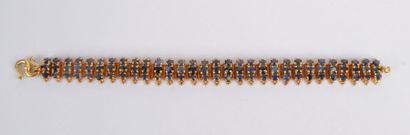 null Bracelet articulé en or 18K (750), orné de saphirs ronds. Longueur: 14,5 cm...