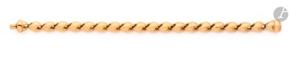  Bracelet en or 18K (750), articulé de petits maillons. Longueur : 19 cm environ....