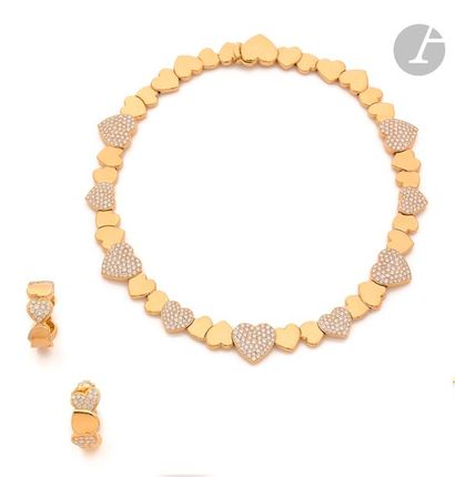 null FRED
Demi-parure en or 18K (750) comprenant : un collier articulé de cœurs imbriqués...