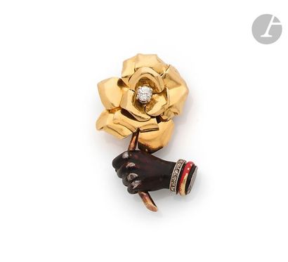 null CARTIER
Broche-clip « Main tenant une rose » composée d’une main en argent laquée...