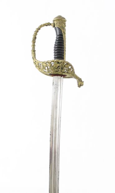 null MARINE OFFICER SABER. 

Varnished handle. Brass mounting, hilt with an openwork...