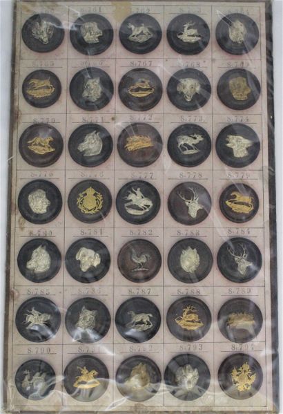 null BOARD OF THIRTY FIVE HANDKERCHIEF BUTTONS, with animal design (or coat of arms)...