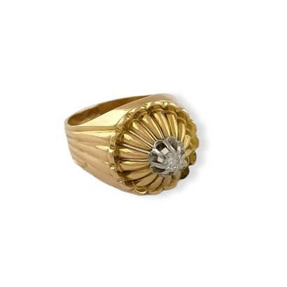null DOME RING Circa 1950 in two-tone gold set with a small brilliant-cut diamond...