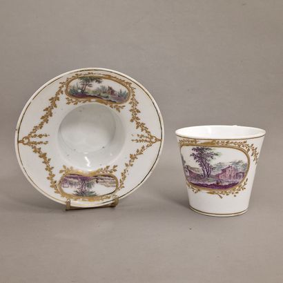 null A TREMBLEUSE CUP and saucer in porcelain with polychrome decoration of landscapes...