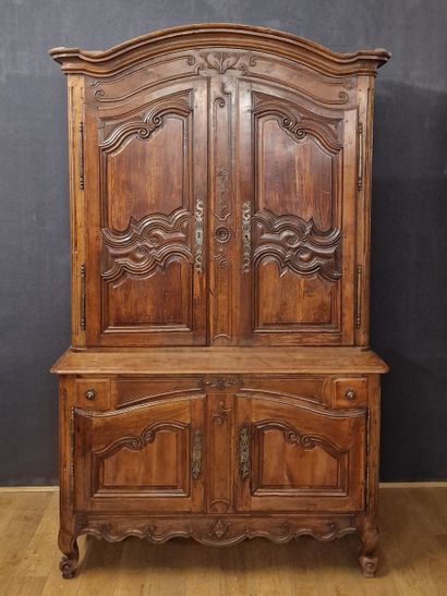 null XVIIIth Century, molded and carved fruitwood BUFFET with recessed top opening...
