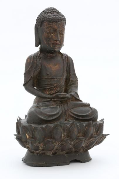 null CHINE XVIIe Siècle

BOUDDHA en bronze partiellement doré assis sur un socle...