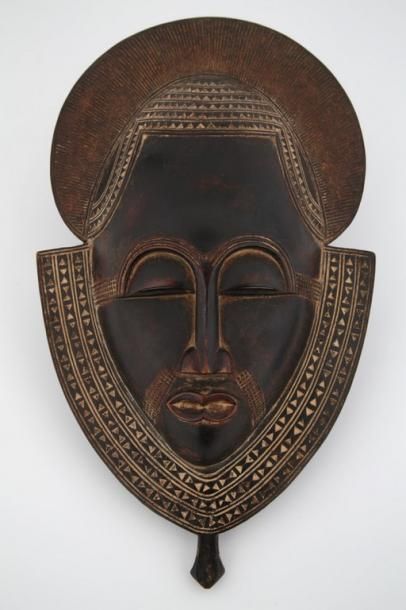 null COTE d'IVOIRE BAOULE Masque portrait finement sculpté et décoré

Ce masque de...