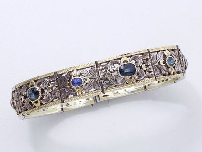 null Bracelet articulé en argent 800 doublé or 750 millièmes, décoré de saphirs en...