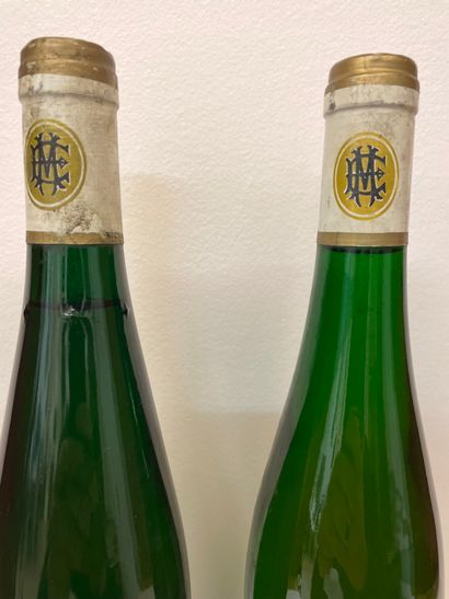 null "Scharzhofberger Spätlese - Egon Müller" (1990). Two bottles. One with a good...
