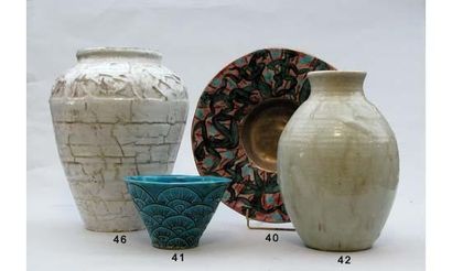 null Edouard CAZAUX 1889-1974
Vase de forme ovoïde en grès émaillé blanc celadonné.
Signé...
