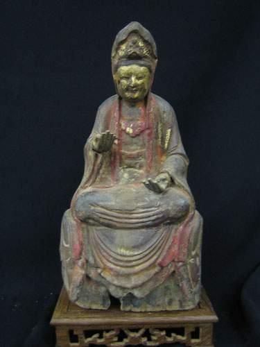 null T'SING (XVIIIe siècle)
Kwanin assise en méditation sur un trône.
En bois sculpté...