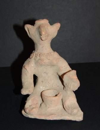 null MEHRGARH (3000 - 2600 av. J.C.)
Idole zoomorphe assise.
Elle tient dans la main...