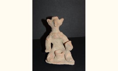 null MEHRGARH (3000 - 2600 av. J.C.)
Idole zoomorphe assise. Elle tient dans la main...