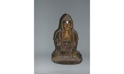 null MING (1368-1643 ap. J. C)
Kwan In à l'enfant en bronze à dorure partielle.
H...