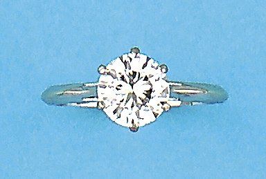 null Bague solitaire en or gris ornée d'un diamant taillé en brillant pesant 1,99...