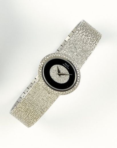 PIAGET Bracelet montre de dame en or gris, le cadran noir et gris serti de diamants,...