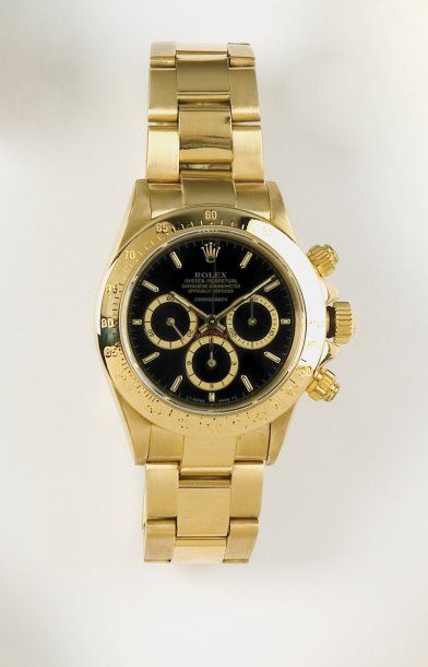 ROLEX "OYSTER PERPETUAL COSMOGRAPH DAYTONA". Bracelet montre chronographe en or jaune....