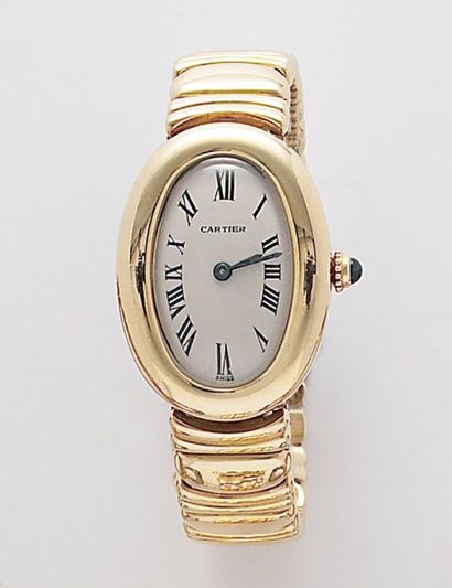 CARTIER "BAIGNOIRE". Bracelet-montre de dame en or jaune. Cadran blanc à chiffres...