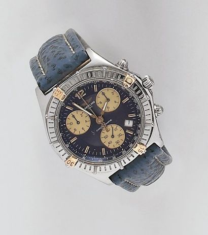 BREITLING Montre de poignet chronographe en or jaune et acier. Cadran bleu à trois...