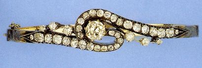 Bracelet rigide ouvrant en or jaune et argent...