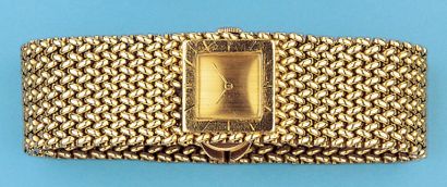 HERMES Bracelet montre de dame en or jaune. Mouvement mécanique. bracelet articulé...