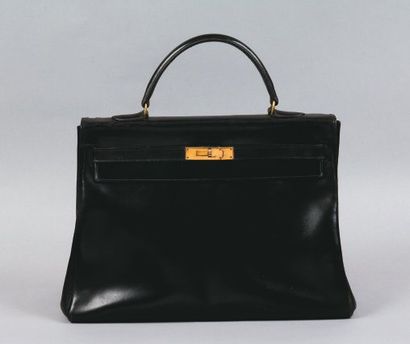 HERMES Paris Sac «Kelly» 35 cm en box noir, fermoir plaqué or, poignée, manque cadenas...