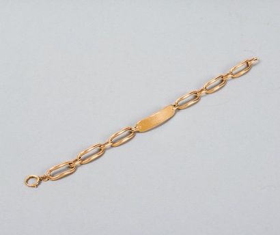HERMES Paris Bracelet gourmette avec plaque d?identité en or jaune, maillons ovales....