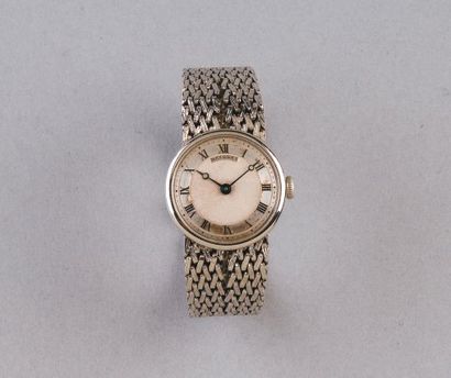 BREGUET pour HERMÈS Bracelet montre de dame en or gris, cadran guilloché gris à chiffres...