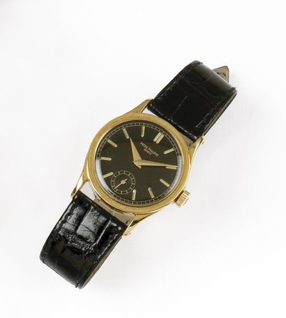 PATEK PHILIPPE «CALATRAVA» Montre de poignet en or jaune. Cadran noir. Trotteuse...