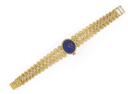 LONGINES Bracelet montre de dame en or jaune. Cadran bleu. Mouvement mécanique. Bracelet...