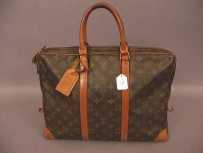 LOUIS VUITTON Porte-documents "Voyage" en toile monogram et cuir naturel, fermeture...