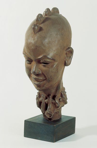 Paul SERSTE (1910-2000) Tête d'africain. Sculpture en terre cuite, signée au dos....