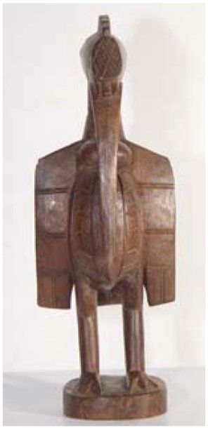 Statuette de calao en bois brun. SENOUFO....