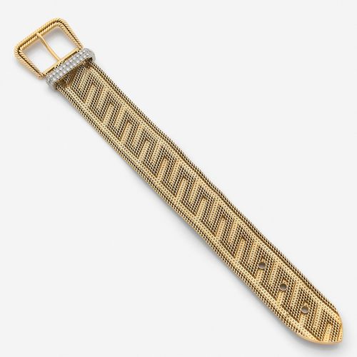 Null CARTIER 
Bracelet ceinture
En or jaune 18k et platine, le ruban plat maille&hellip;