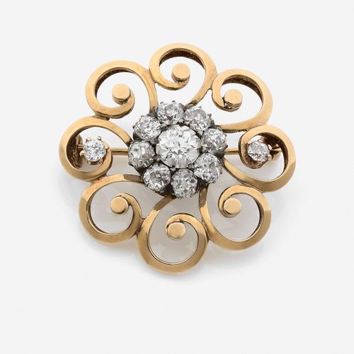 Null 
Broche
En or jaune 18k et argent, stylisant une rose à décor ajouré, le ce&hellip;