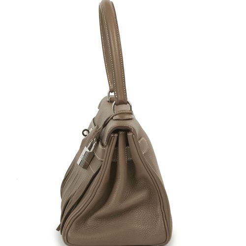 Null HERMÈS
Édition Limitée
2009
Sac KELLY SHOULDER FRINGE
Taurillon Clémence Ét&hellip;