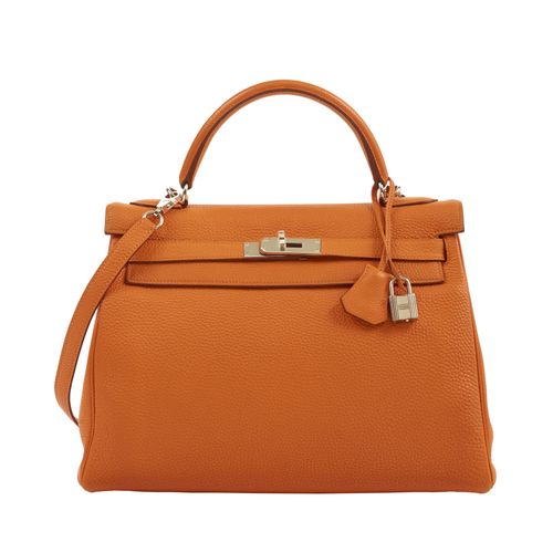 Null HERMÈS
2007
Sac KELLY Retourné 32
Veau Togo orange
Garniture métal argenté &hellip;