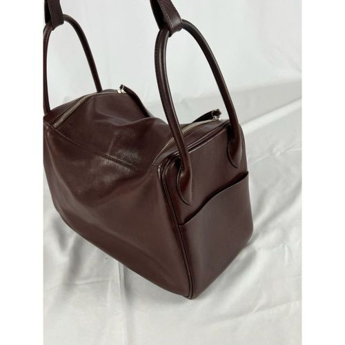HERMES. Handbag " Lindy " in brown and burgundy leather. Palladium metal trim. D&hellip;