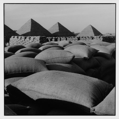 Almasy, Paul "Pyramids of peanut bags, Kano". 

Silver gelatin print. 28,3 x 28 &hellip;