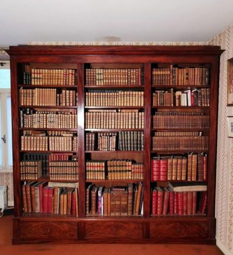 Null A mahogany veneered bookcase with three compartments and three drawers in t&hellip;