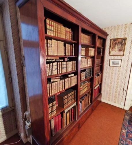 Null A mahogany veneered bookcase with three compartments and three drawers in t&hellip;