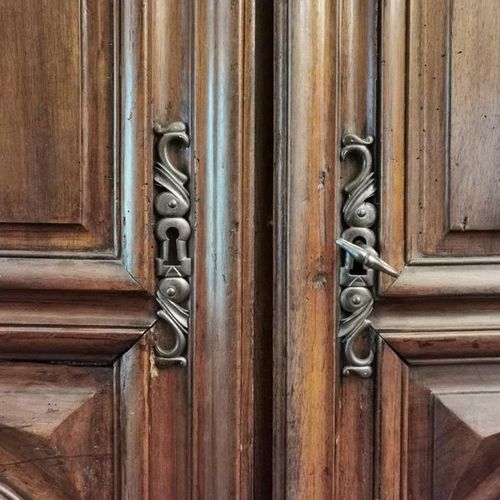 Null A natural wood cupboard opening with two doors richly molded with arcatures&hellip;