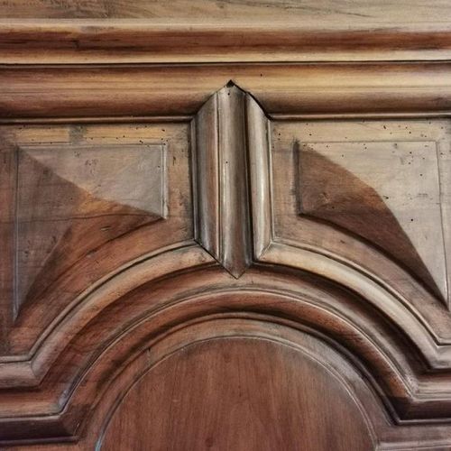 Null A natural wood cupboard opening with two doors richly molded with arcatures&hellip;