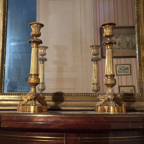 Null PAIR OF FLAMPS in gilded and chased bronze, the fluted shaft, three lion cl&hellip;